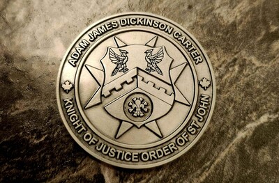 Challenge coin awarded by Adam J.D. Carter